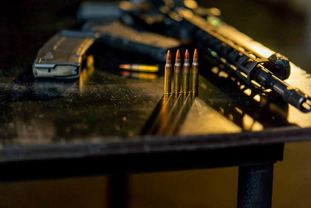 Bullets and rifle on a table