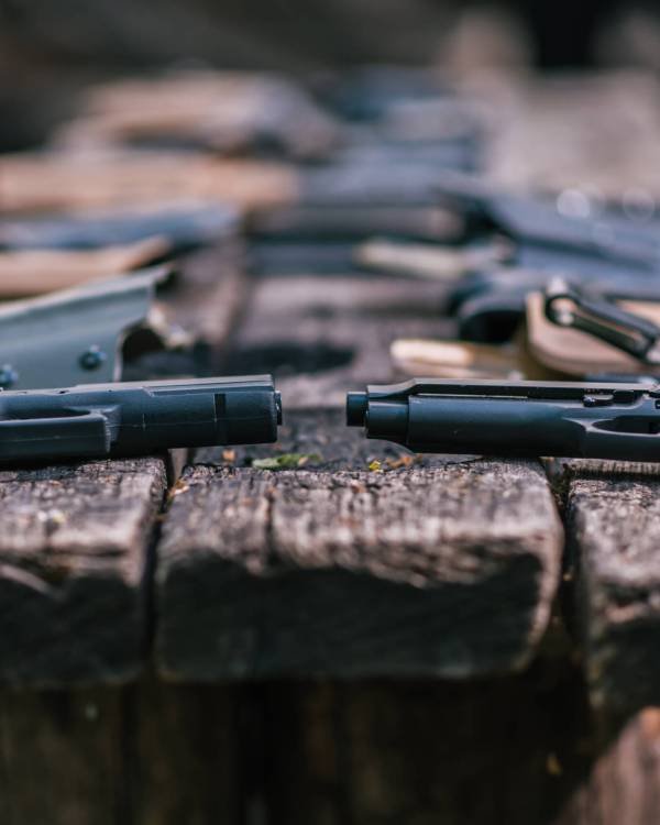 pistols-for-shooting-sports-lie-on-a-wooden-table-2026-01-11-08-57-08-utc